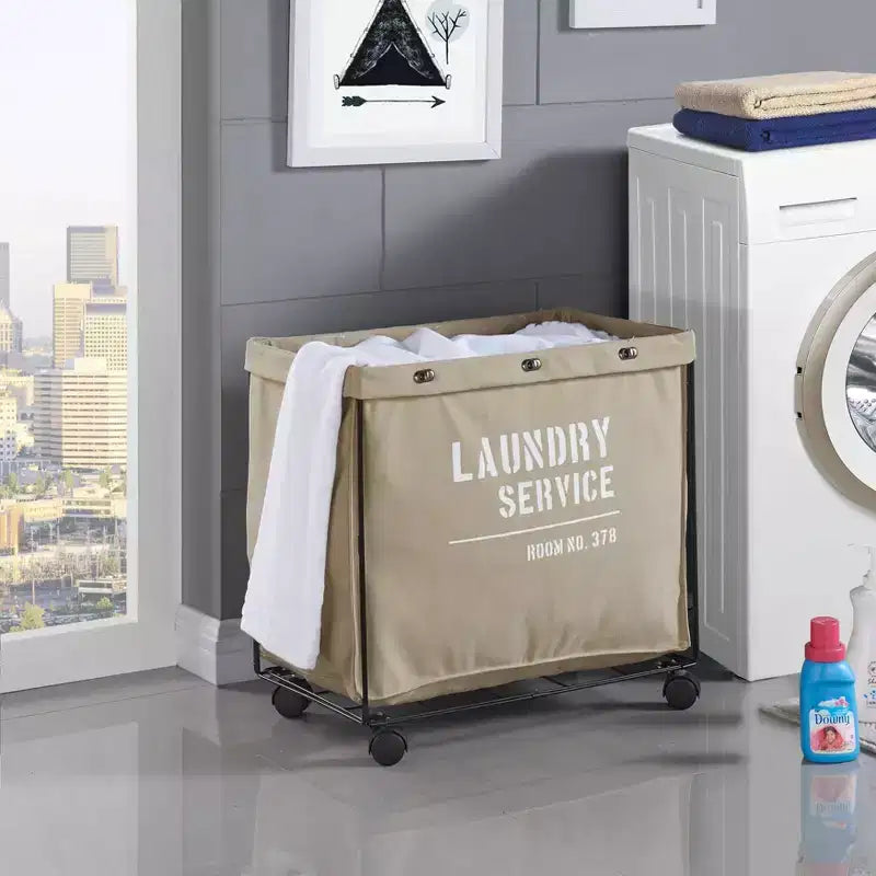 Danya B. Cesto Portabiancheria in Tela con Ruote: Cesto per Vestiti Beige Resistente, Telaio Portatile in Ferro, Capacità di 32 Litri