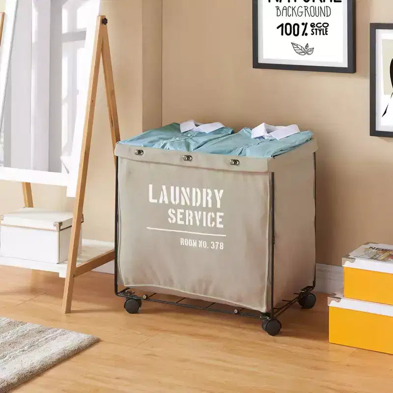 Danya B. Cesto Portabiancheria in Tela con Ruote: Cesto per Vestiti Beige Resistente, Telaio Portatile in Ferro, Capacità di 32 Litri