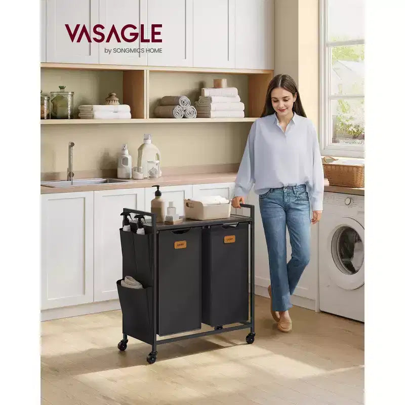 VASAGLE Cesto Portabiancheria, Carrello con Ruote e Ripiani, Tasche Laterali, 6 Etichette, 2 Scomparti, 100 L, Nero Inchiostro e Marrone Cenere