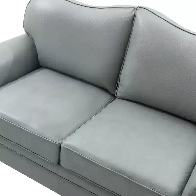 Divanetto Chesterfield Antonia largo 152 cm in vera pelle con finiture borchiate e braccioli arrotolati